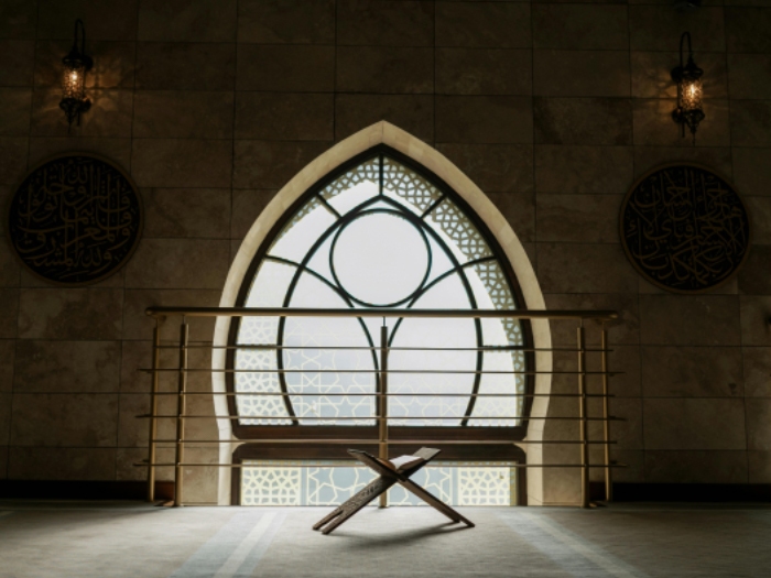 A Quran in front of a window