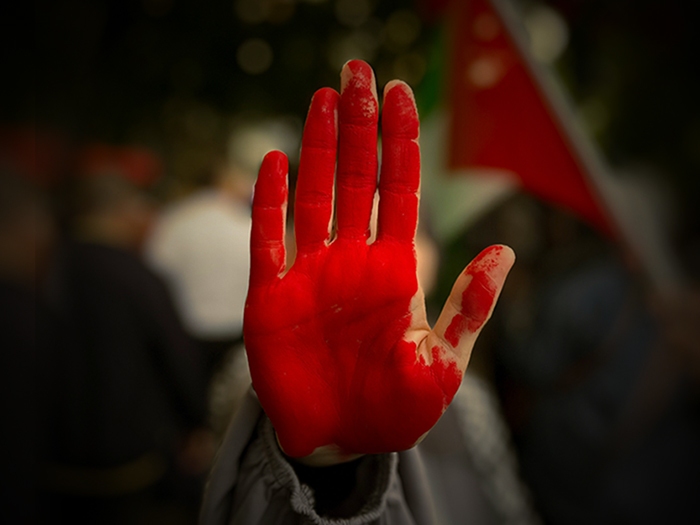 Red hand at a protest