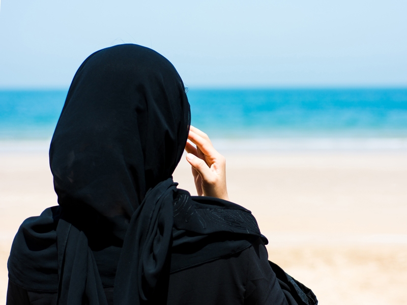 Muslim woman at the beach