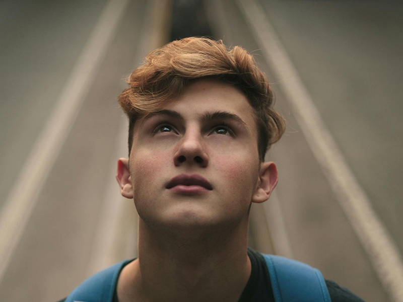 Young man looking up
